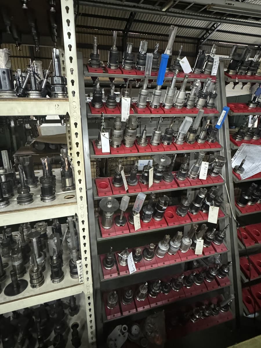 Racks of CNC tool holders in a machine shop